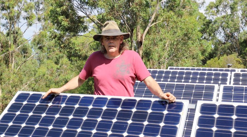 Paul with the solar panels for his environmentally-friendly pad